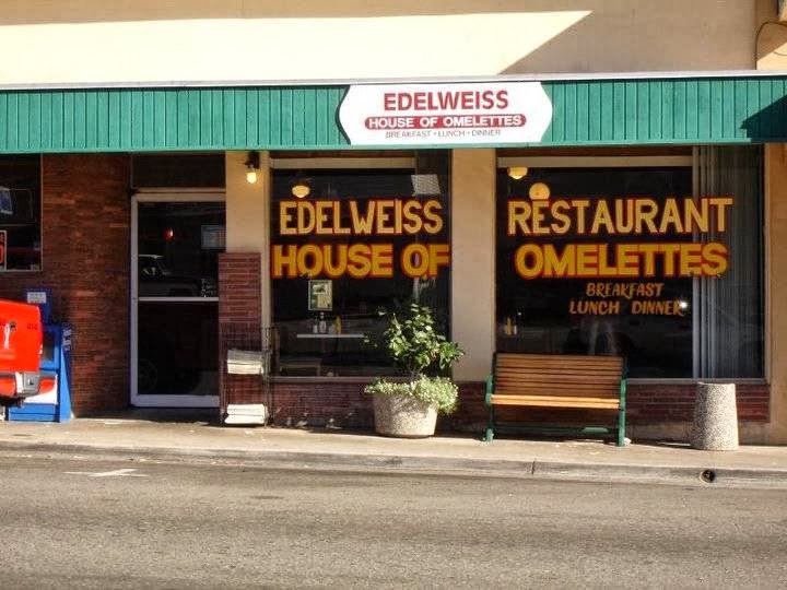 Cozy diner tables with breakfast plates.